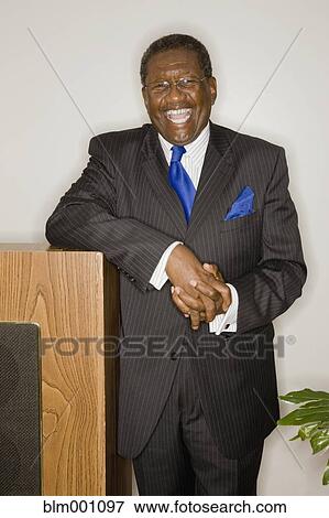 Senior African man laughing at podium View Large Photo Image Stock Photo - Senior African man laughing at podium. Fotosearch