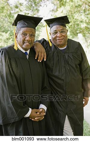 Stock Image - Senior African men in graduation caps and robes. Fotosearch