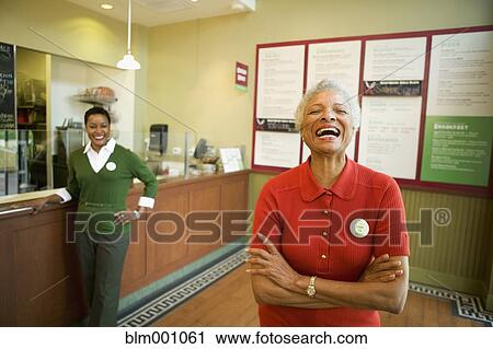 Senior African woman laughing in cafe View Large Photo Image Stock Image - Senior African woman laughing in cafe. Fotosearch