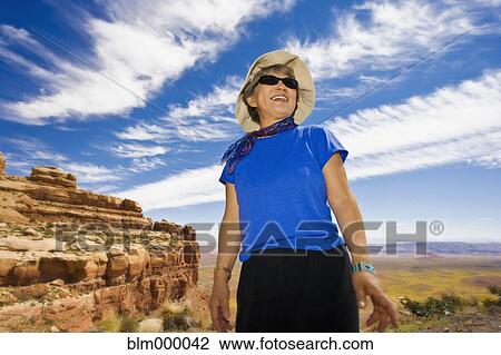 Senior Asian woman in desert View Large Photo Image Stock Image - Senior Asian woman in desert. Fotosearch