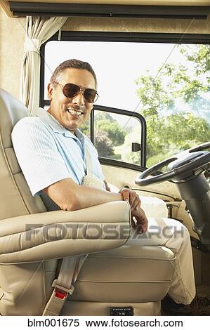 Senior Hispanic man in recreational vehicle View Large Photo Image Stock Photography - Senior Hispanic man in recreational vehicle. Fotosearch