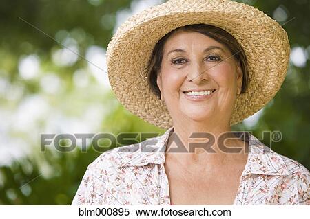 Senior Hispanic woman wearing straw hat View Large Photo Image Stock Photography - Senior Hispanic woman wearing straw hat. Fotosearch