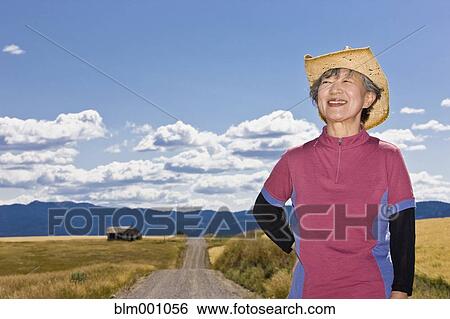 Senior Japanese woman on dirt road in countryside View Large Photo Image Stock Photograph - Senior Japanese woman on dirt road in countryside. Fotosearch