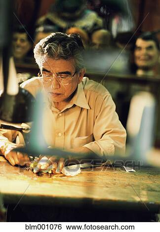 Senior man working at workshop table View Large Photo Image Stock Photograph - Senior man working at workshop table. Fotosearch