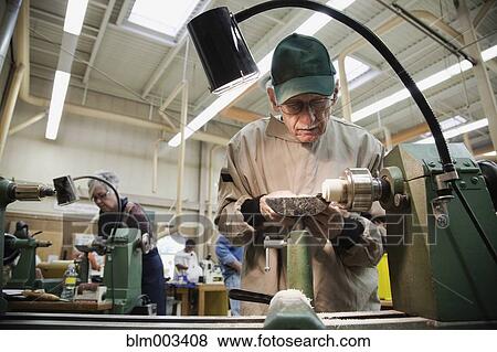Senior man working in workshop View Large Photo Image Stock Photo - Senior man working in workshop. Fotosearch