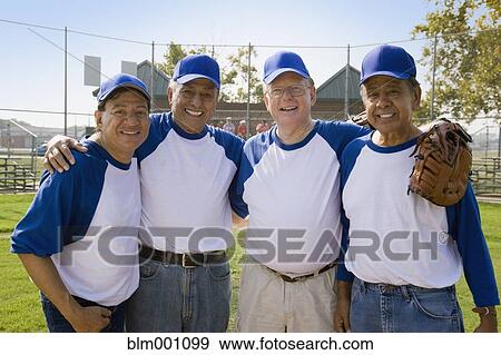 Stock Photo - Senior men playing on baseball team. Fotosearch
