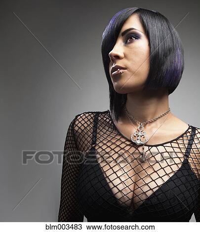 Stock Image - Sexy Hispanic woman in fishnet top. Fotosearch