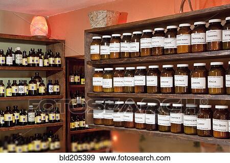 Stock Photo - Shelves full of jars in an Apothecary shop. Fotosearch