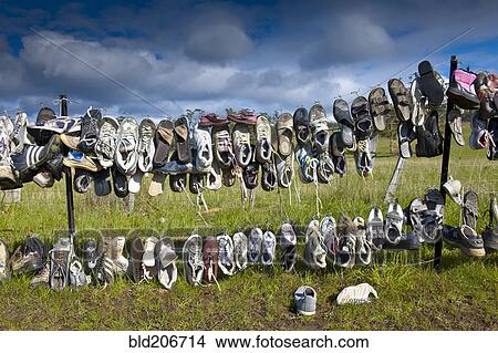 Shoes Hanging on Fence View Large Photo Image Picture - Shoes Hanging on Fence. Fotosearch