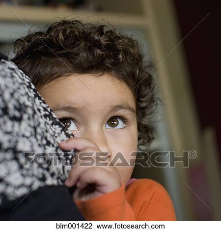 Shy mixed race boy hiding View Large Photo Image Stock Image - Shy mixed race boy hiding. Fotosearch