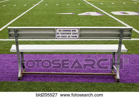 Stock Photo - Sign on Athletic Field Bench. Fotosearch