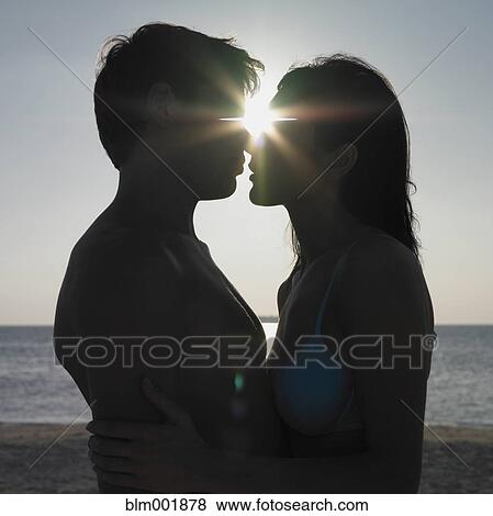 Silhouette of couple hugging at beach View Large Photo Image Stock Photo - Silhouette of couple hugging at beach. Fotosearch