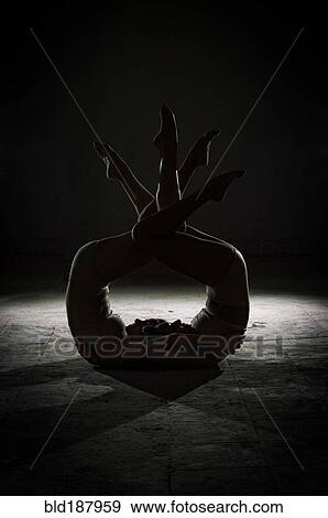 Silhouette of dancers posing in studio View Large Photo Image Stock Photo - Silhouette of dancers posing in studio. Fotosearch