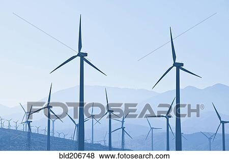 Silhouette of wind turbines View Large Photo Image Stock Photo - Silhouette of wind turbines. Fotosearch
