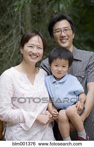 Smiling Asian family View Large Photo Image Stock Photograph - Smiling Asian family. Fotosearch