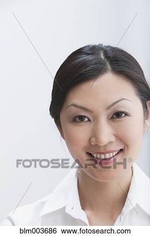 Stock Photograph - Smiling Chinese businesswoman. Fotosearch
