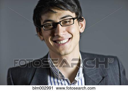 Smiling mixed race businessman in eyeglasses View Large Photo Image Stock Image - Smiling mixed race businessman in eyeglasses. Fotosearch