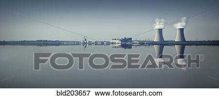Smoke stacks and factory reflected in still lake View Large Photo Image Stock Photo - Smoke stacks and factory reflected in still lake. Fotosearch
