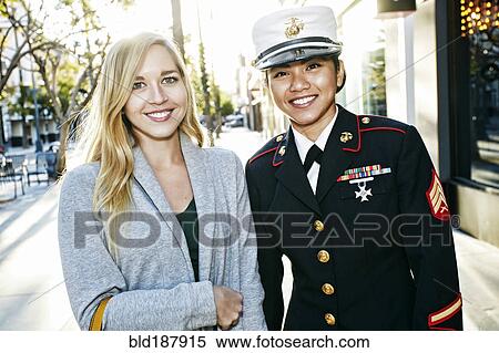 Soldier smiling with friend outdoors View Large Photo Image Stock Photography - Soldier smiling with friend outdoors. Fotosearch