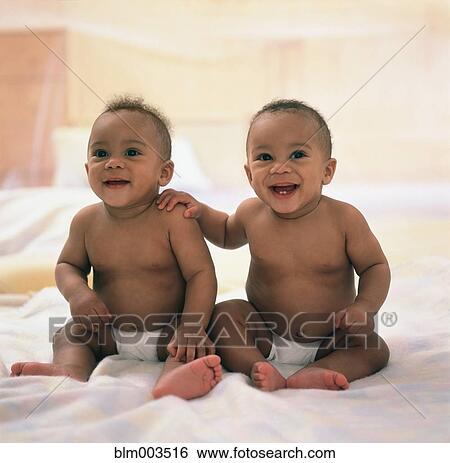 Spanish twin baby boys sitting on blanket View Large Photo Image Stock Photograph - Spanish twin baby boys sitting on blanket. Fotosearch