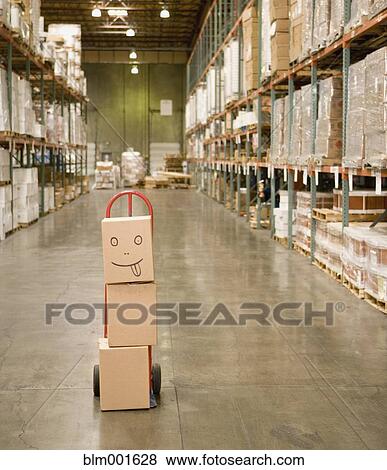 Stack of boxes in warehouse with smiley face View Large Photo Image Stock Photo - Stack of boxes in warehouse with smiley face. Fotosearch