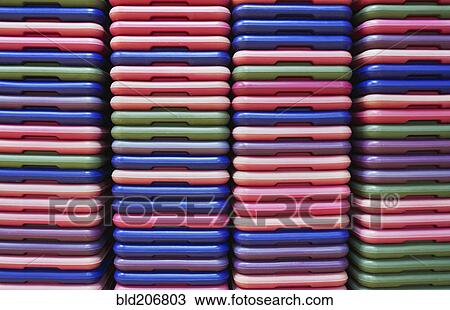 Stack of colorful plastic step mats for step class in a recreation center View Large Photo Image Stock Image - Stack of colorful plastic step mats for step class in a recreation center. Fotosearch