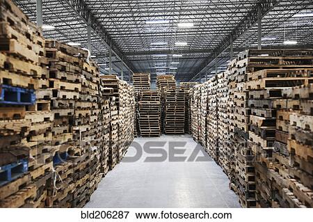 Stock Photo - Stacked pallets in warehouse. Fotosearch