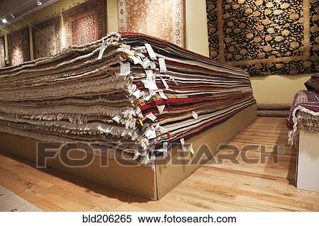 Stacked rugs in shop View Large Photo Image Stock Photography - Stacked rugs in shop. Fotosearch