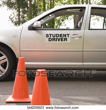 Stock Image - Student Driver Car and Traffic Cones. Fotosearch