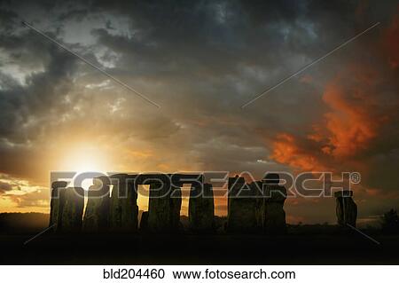 Sun rising over Stonehenge, Wiltshire, United Kingdom View Large Photo Image Stock Image - Sun rising over Stonehenge, Wiltshire, United Kingdom. Fotosearch