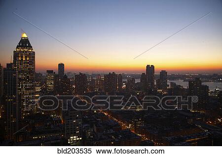 Sunset and illuminated cityscape, New York, New York, United States View Large Photo Image Stock Photography - Sunset and illuminated cityscape, New York, New York, United States. Fotosearch