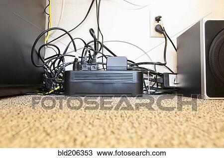 Stock Image - Surge Protector and Many Power Cables. Fotosearch
