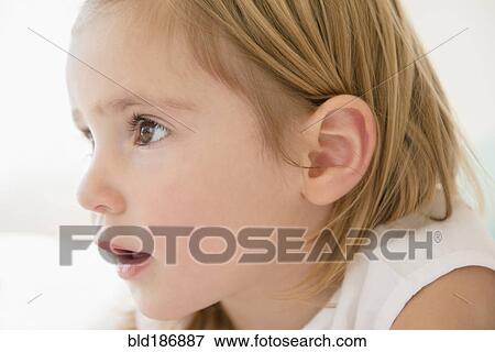 Stock Photo - Surprised Caucasian girl staring. Fotosearch
