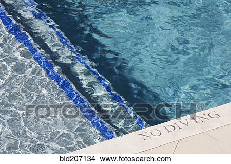 Picture - Swimming Pool Edge With No Diving Sign. Fotosearch