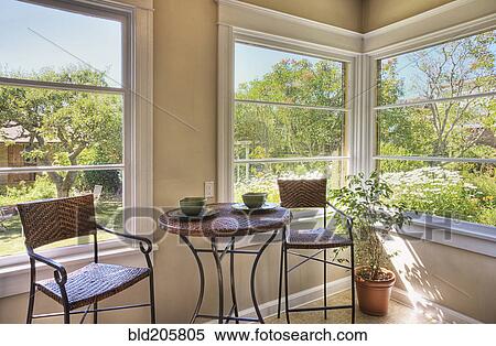 Stock Photography - Table and Chairs in Corner Sun Room. Fotosearch