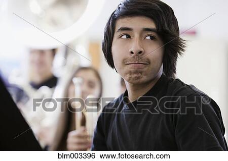Stock Photograph - Teenage boy in band practice. Fotosearch