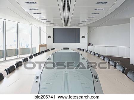 Stock Image - Television and large table in modern conference room. Fotosearch