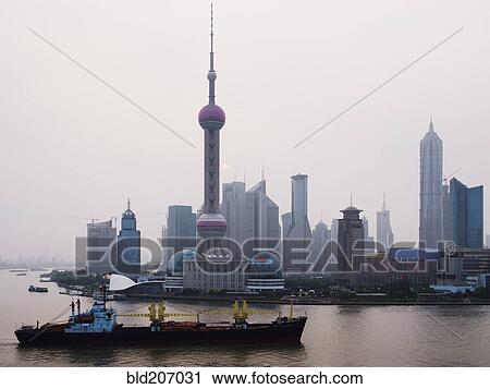 Stock Image - Traffic on Huang Pu River at Sunrise. Fotosearch