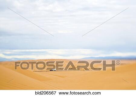Stock Photo - Truck Driving Through Desert. Fotosearch