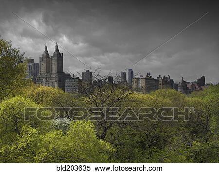 Urban park, skyscrapers and cloudy sky, New York, New York, United States View Large Photo Image Stock Photography - Urban park, skyscrapers and cloudy sky, New York, New York, United States. Fotosearch