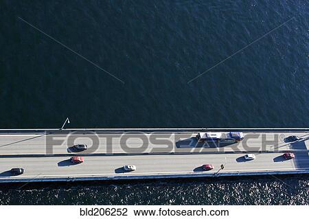 Stock Image - View of cars driving over floating bridge. Fotosearch