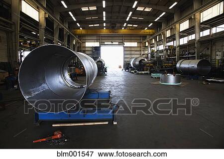 Stock Photo - Warehouse with large metal pipes. Fotosearch