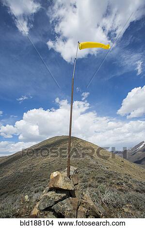 Wind sock on remote hilltop View Large Photo Image Picture - Wind sock on remote hilltop. Fotosearch