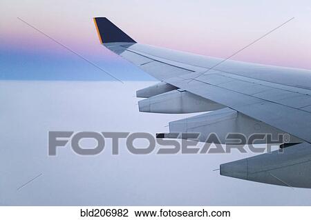 Stock Image - Wing and Engines of Jet in Flight. Fotosearch