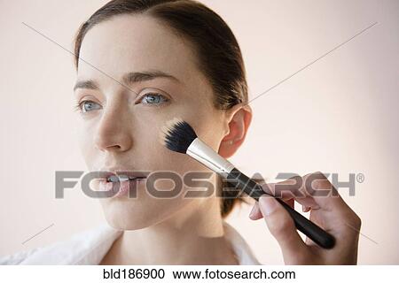 Woman having makeup applied by stylist View Large Photo Image Stock Image - Woman having makeup applied by stylist. Fotosearch