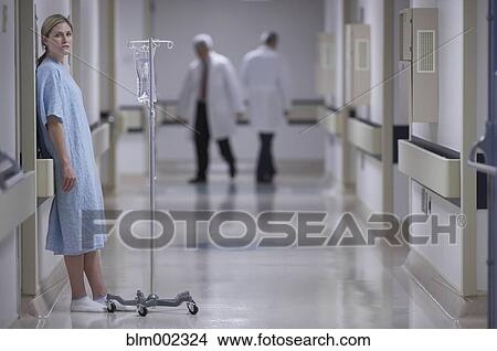 Woman in hospital gown with IV View Large Photo Image Picture - Woman in hospital gown with IV. Fotosearch