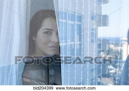 Woman looking out window View Large Photo Image Stock Photo - Woman looking out window. Fotosearch