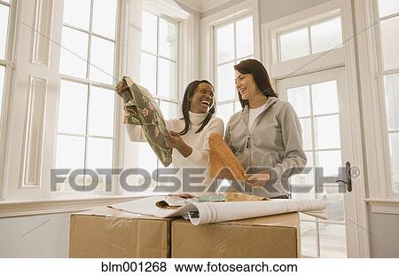 Women planning interior design View Large Photo Image Stock Photo - Women planning interior design. Fotosearch