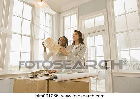 Stock Photograph - Women planning interior design. Fotosearch