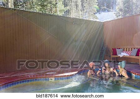 Women relaxing in hot tub View Large Photo Image Picture - Women relaxing in hot tub. Fotosearch
